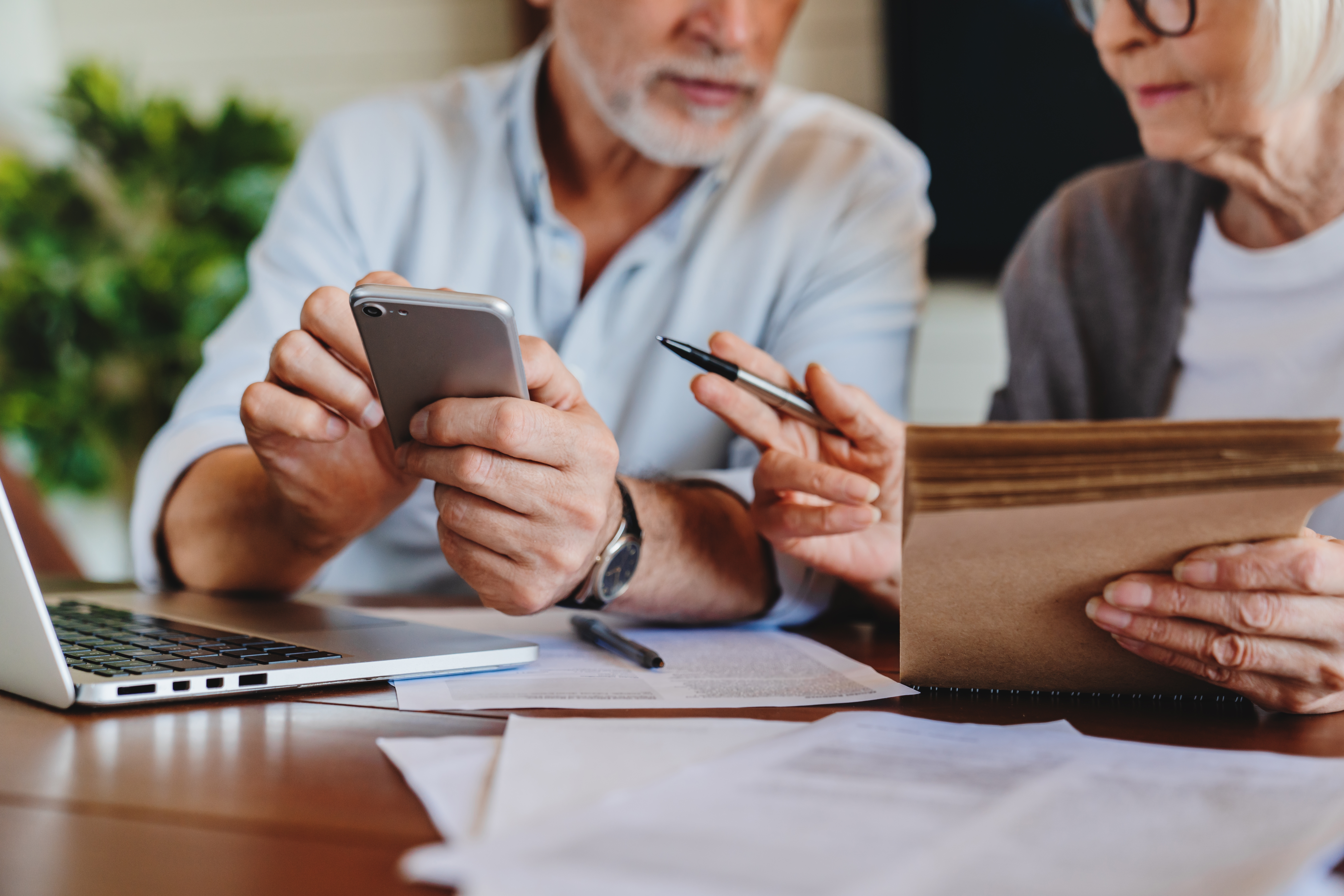 Elderly couple handling money