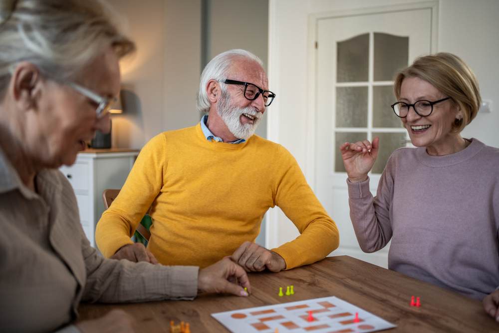 Group of elders playing board games